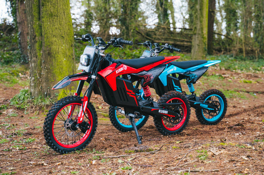 Child learning to ride a Kubbi electric dirt bike outdoors