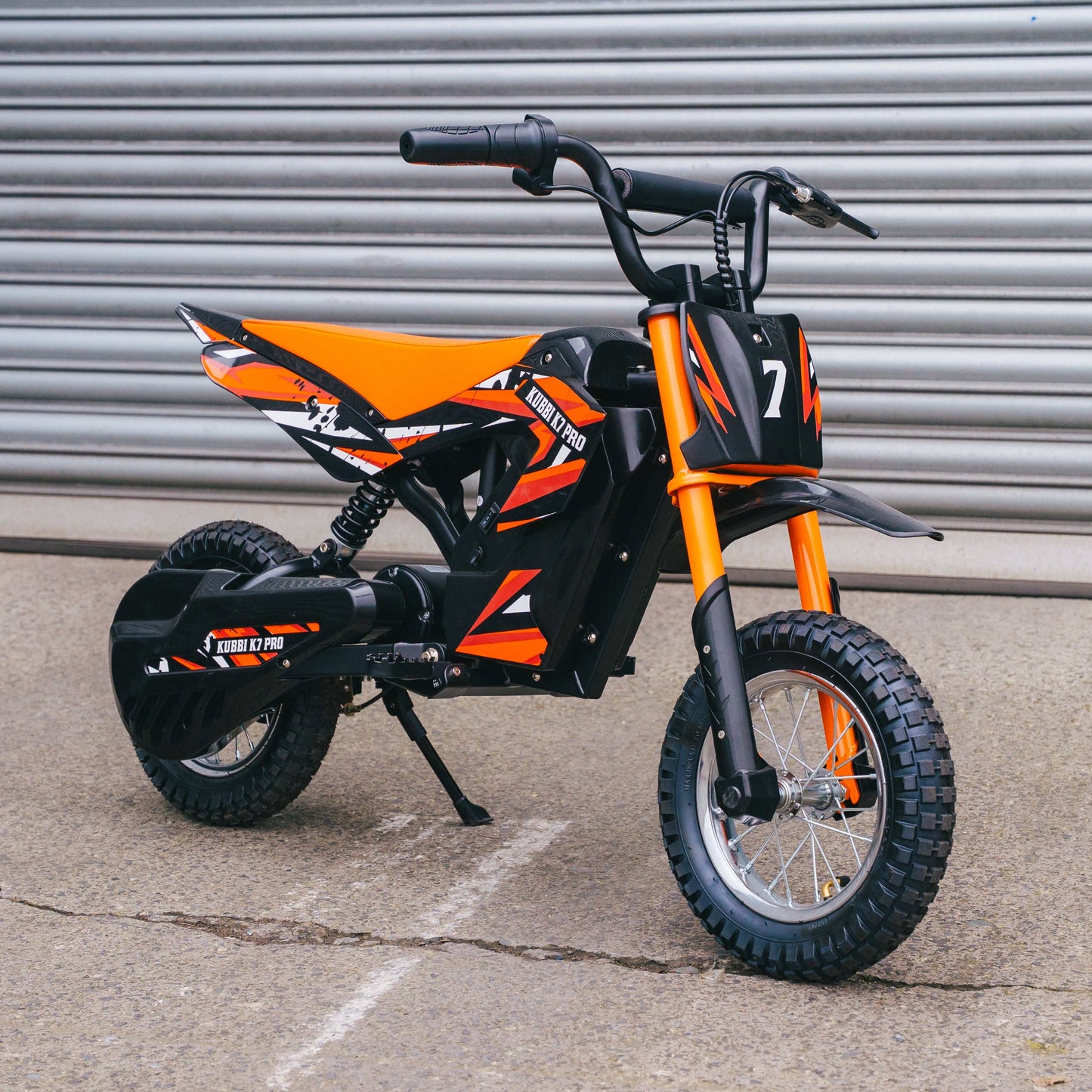 Kubbi K7 Pro Dirt Bike for kids aged 6-10 with 300W motor, 3 speed modes, 14-inch off-road tires, and safety features
