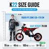 Teen riding Kubbi K22 electric dirt bike on off-road trail in blue color