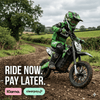 Teen riding green Kubbi K10 Pro electric dirt bike on off-road trail