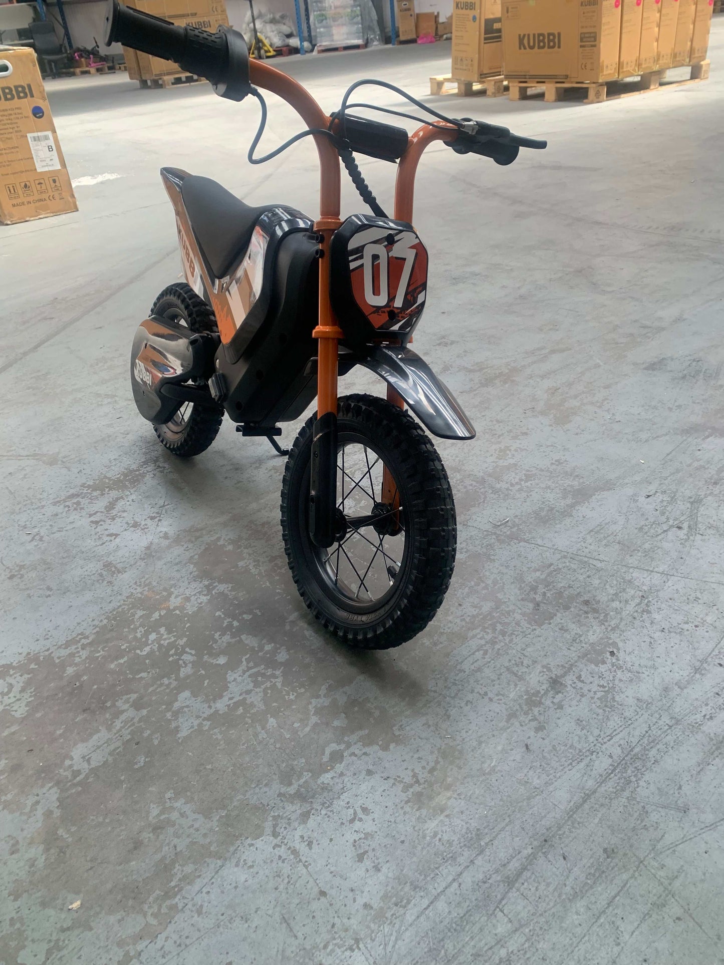 Kubbi Mini Electric Dirt Bike in orange, brand new and unused, warehouse deal, Belfast collection only