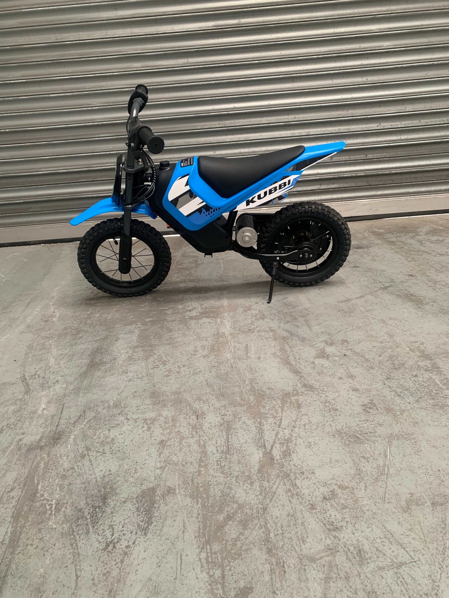 Kubbi Mini Electric Dirt Bike in blue, nearly new, excellent condition, warehouse deal