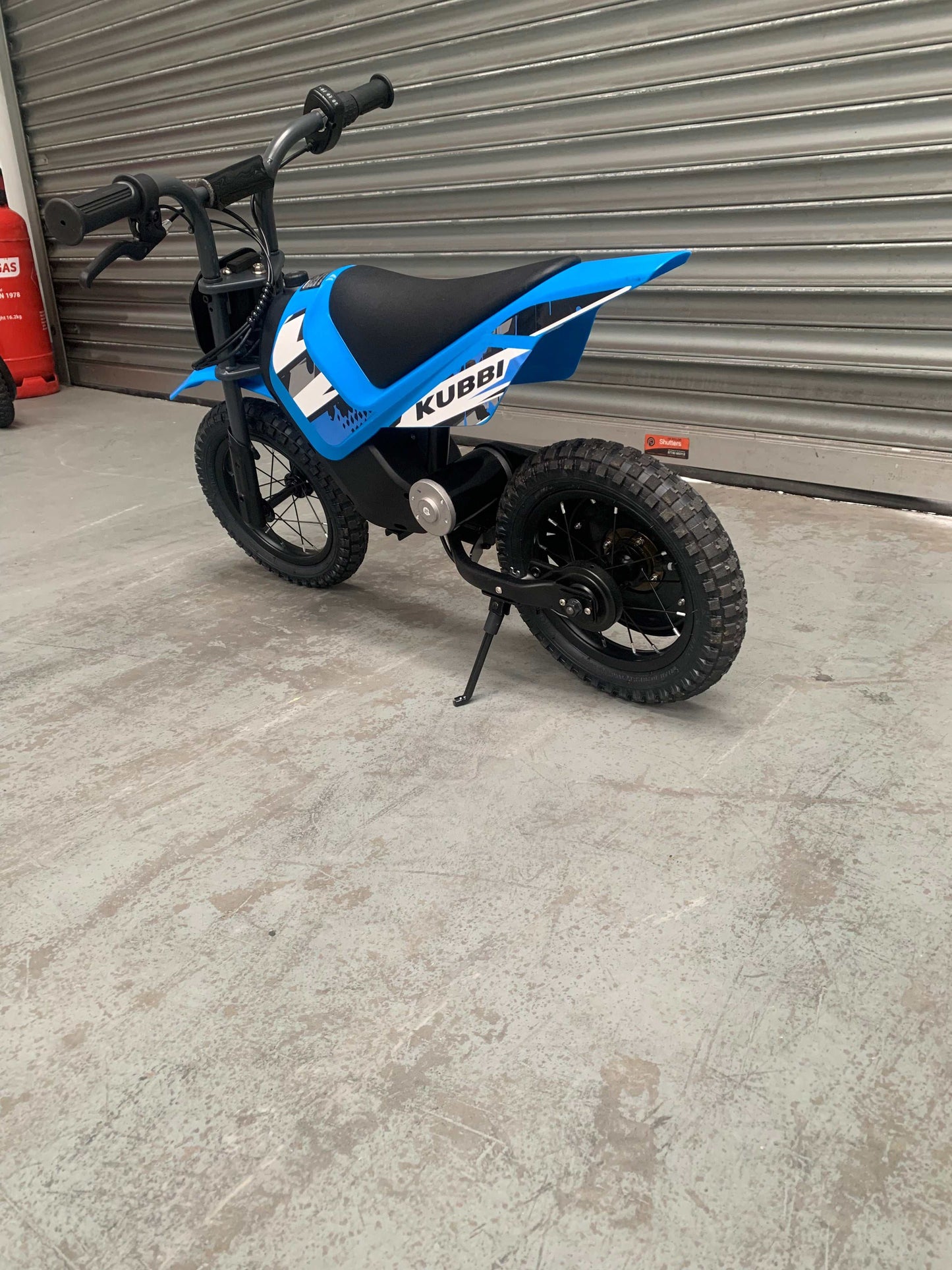 Kubbi Mini Electric Dirt Bike in blue, excellent condition, ridden once and fully operational, warehouse deal