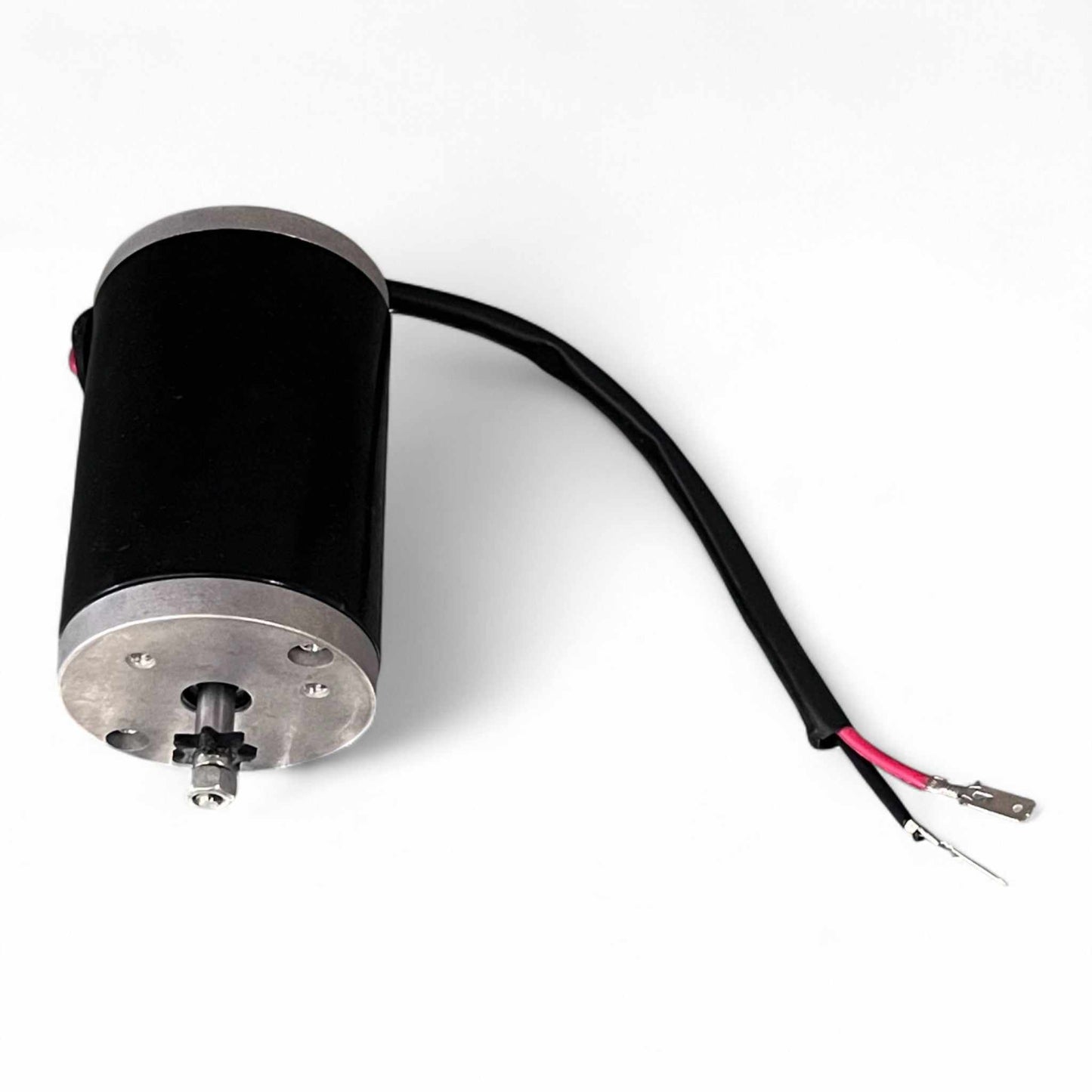 Mini motor with black casing and connected wires isolated on white background