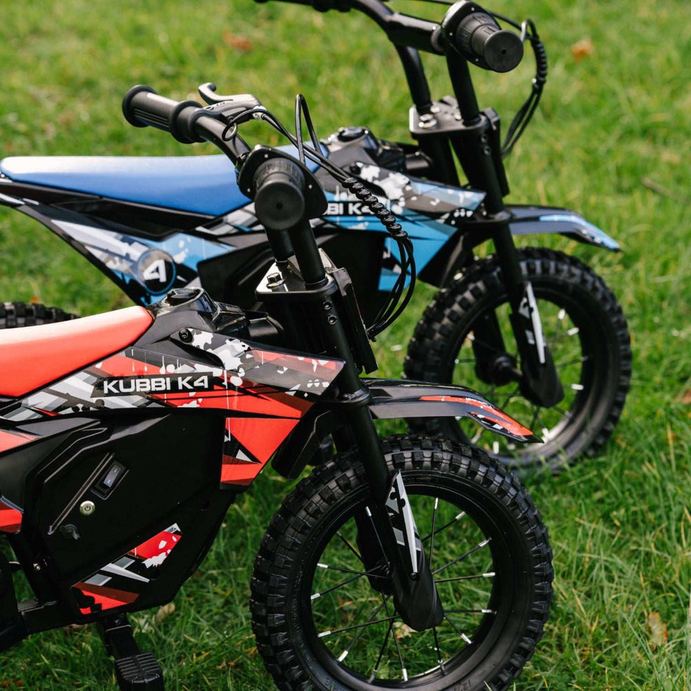 Kubbi K4 kids electric dirt bike with 12-inch off-road tires and 150W motor on grass field