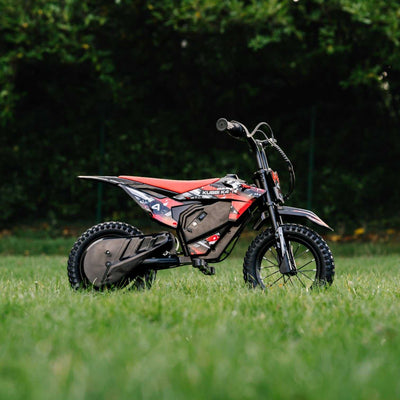Kubbi K4 Dirt Bike electric kids off-road bike with 12-inch tires and 150W motor on grass