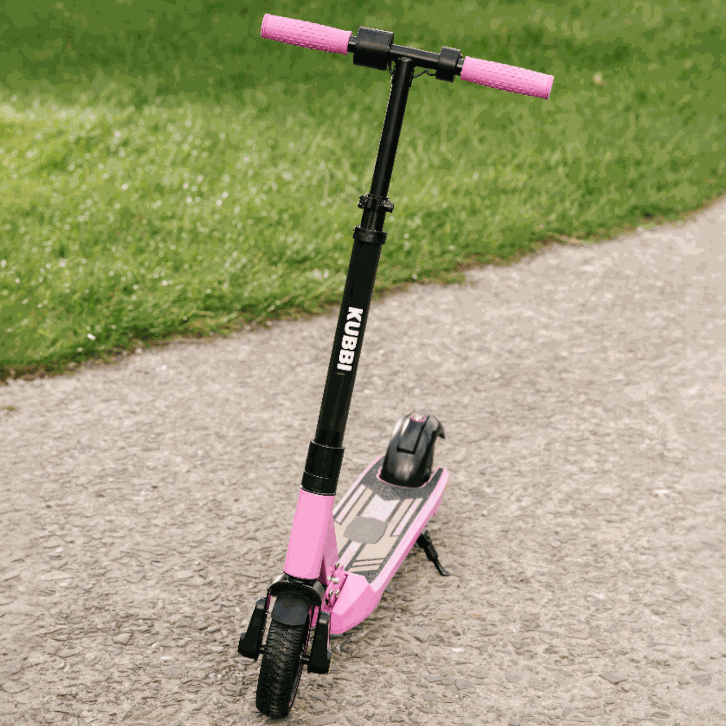 Kubbi S9 Pro kids electric scooter with pink handlebars and black frame on pavement path