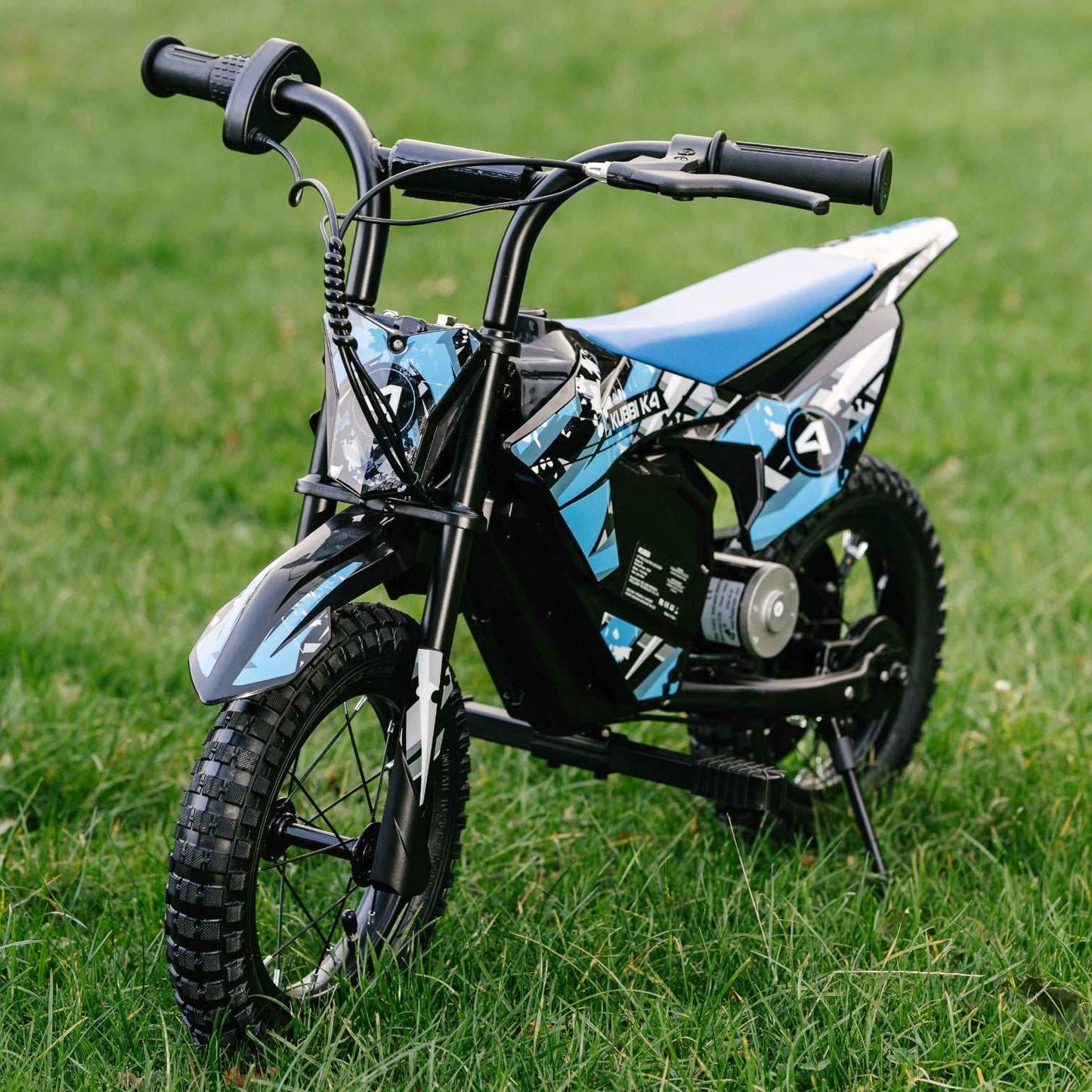 Kubbi K4 Dirt Bike for kids aged 3-9 with 150W motor and 12-inch off-road tires on grass