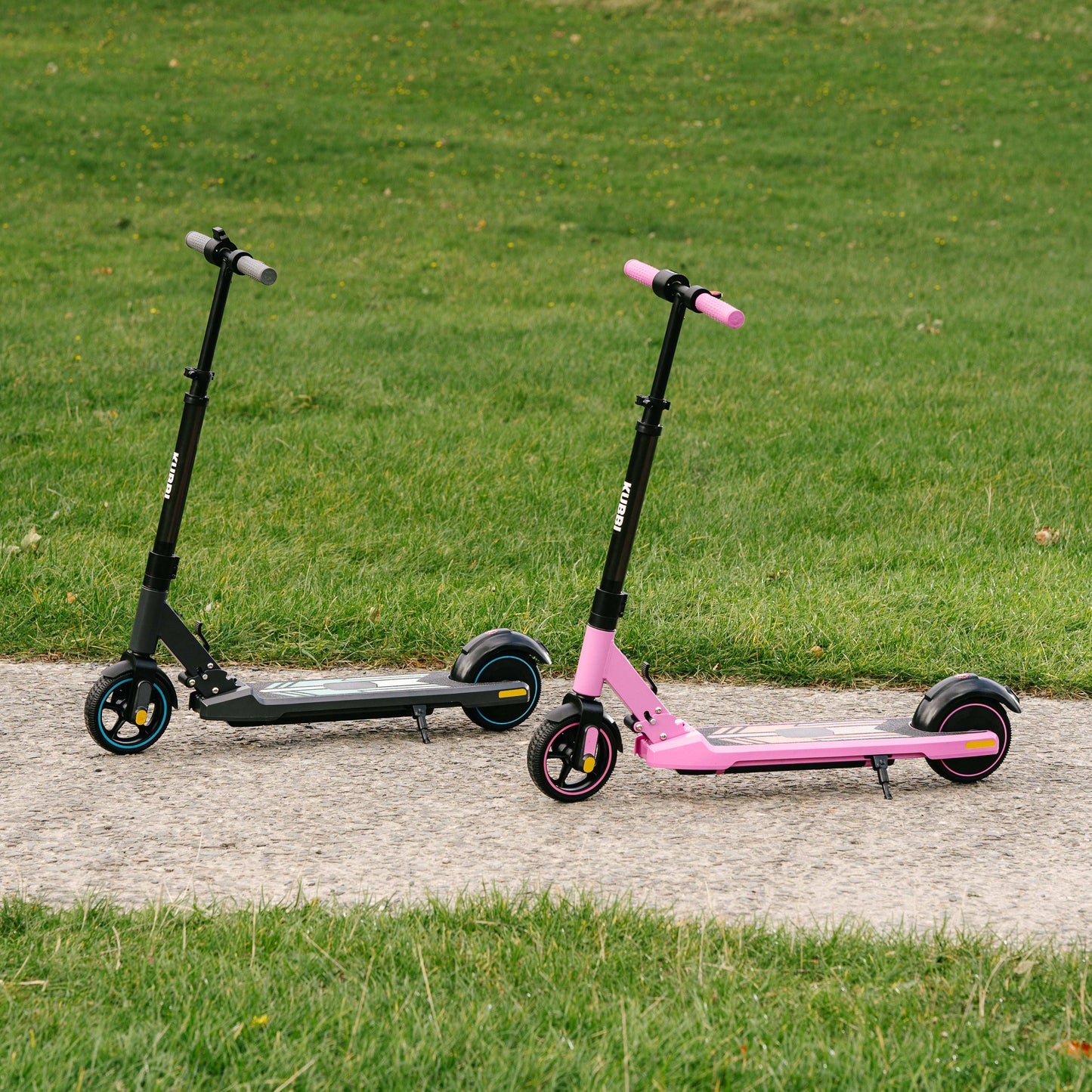 Kubbi S9 Pro electric scooters in black and pink parked on pathway with grass background