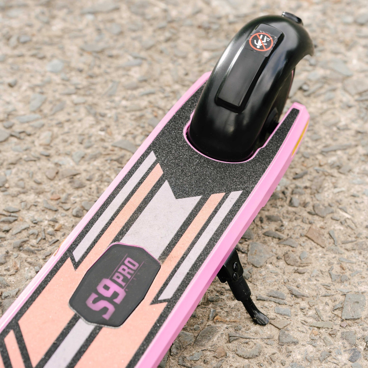 Kubbi S9 Pro electric scooter deck with pink and black design on textured ground
