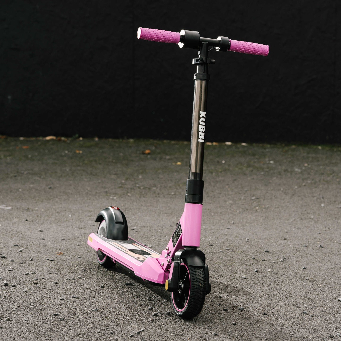 Kubbi S9 Pro pink electric scooter with black accents on asphalt background
