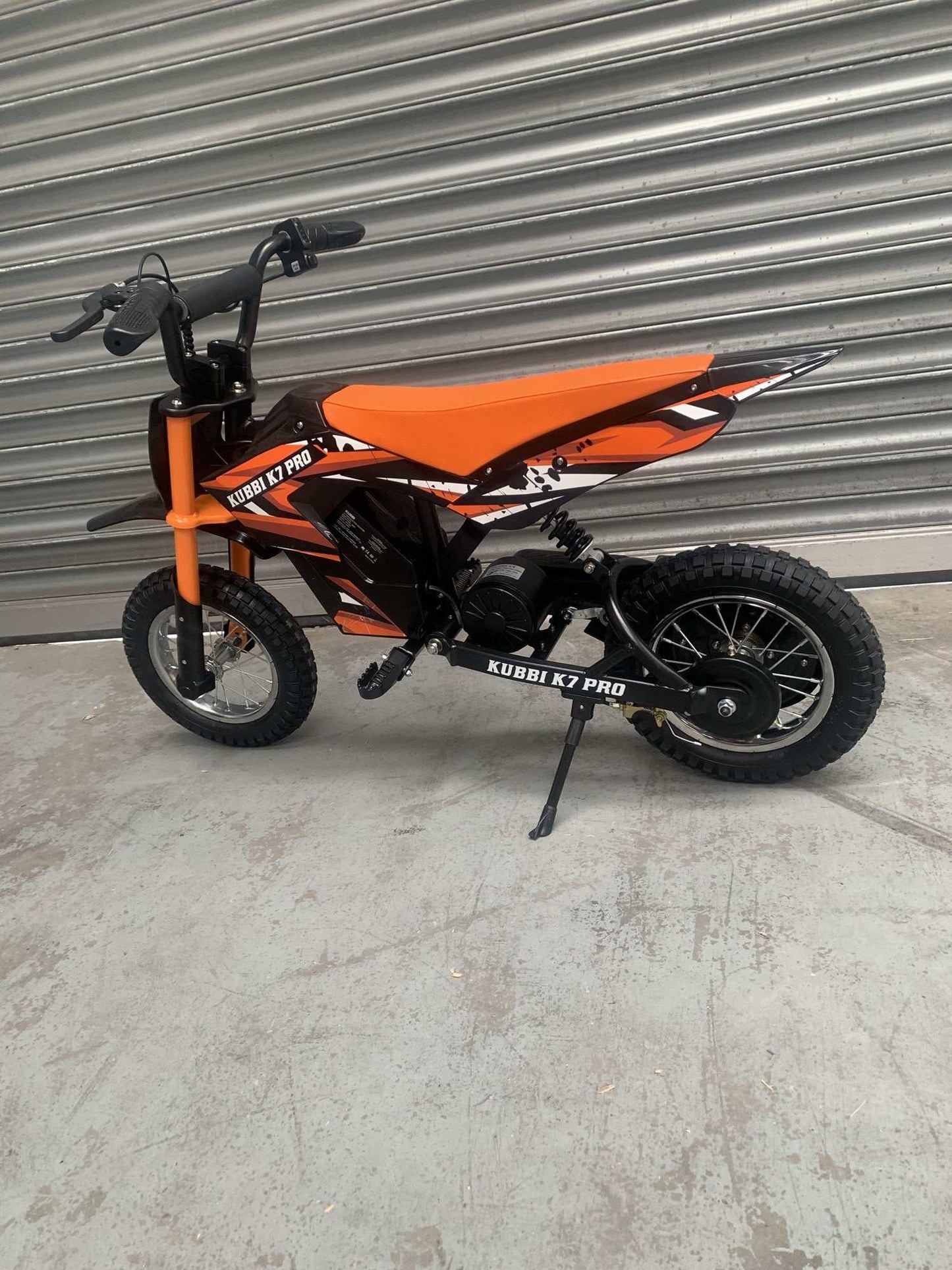 Kubbi K7 Pro orange electric dirt bike in new condition for kids warehouse deal